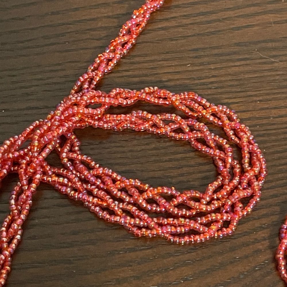 Red iridescent glass seed bead braided long necklace.